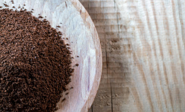 ground coffee bean on wooden table