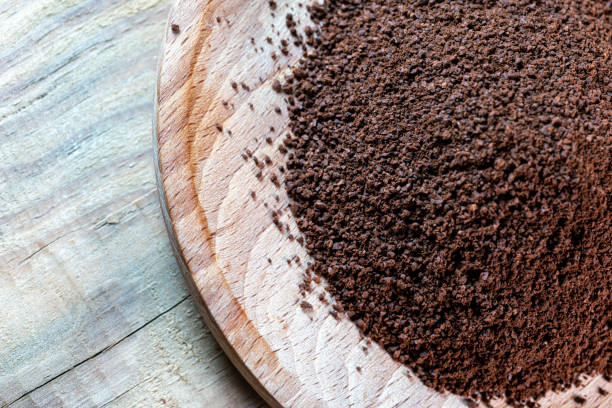 ground coffee bean on wooden table