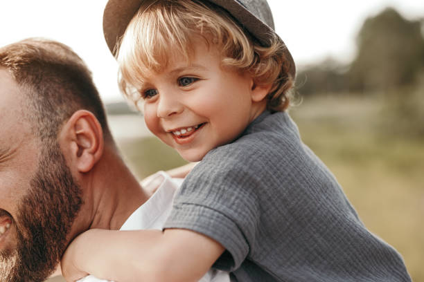 istock Father piggybacking child in nature 1391504784