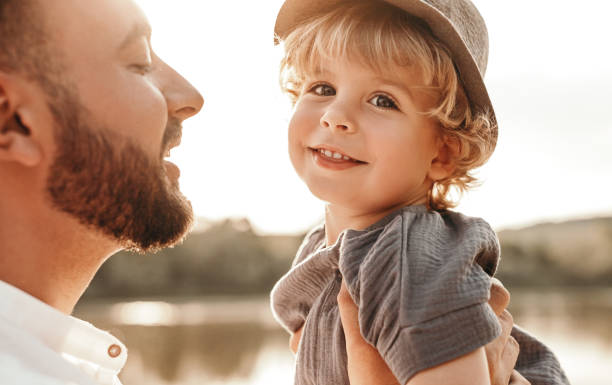 istock Cute son in arms of father 1391504793