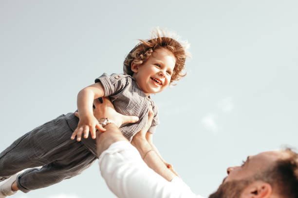 istock Father and child having fun together in summertime 1391504794