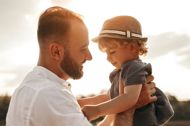 istock Happy father playing with son in nature 1391504796