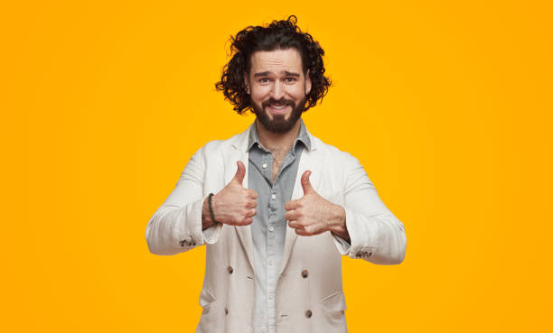 istock Smiling stylish man showing thumbs up 1391504864