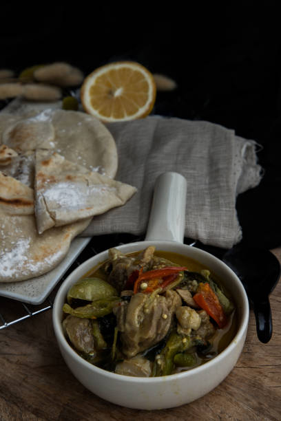 istock Homemade pita bread served with Green curry chicken. 1391506367