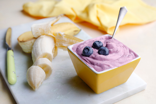 Dairy free frozen banana ice cream with blueberry.