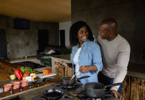 istock Black couple cooking together at home 1391517631