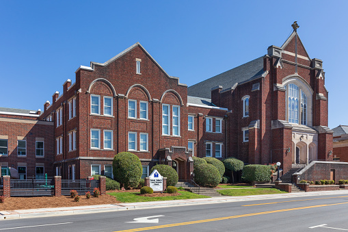 Rock Hill, SC, USA-10 April 2022: St. John's United Methodist Church main sanctuary building and monument sign.