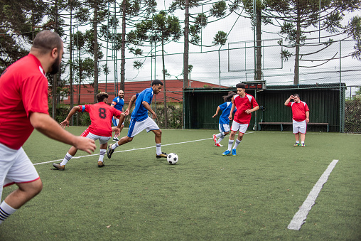 Soccer players vying for the ball