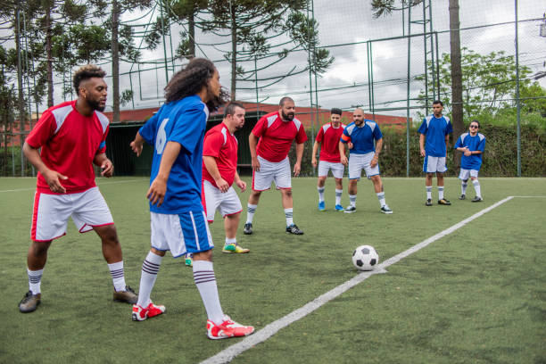 istock Player with down syndrome in free kick 1391525847