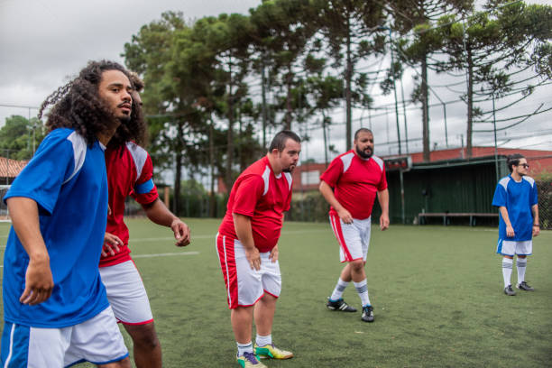 istock Player with down syndrome in free kick 1391525848