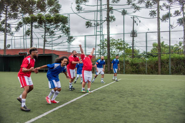 istock Player with Down Syndrome celebrating a goal 1391525851