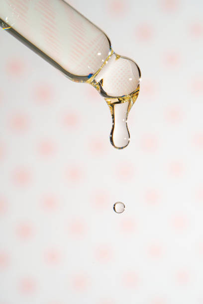 istock A dripping pipette with a drop of cosmetics gel. 1391530875