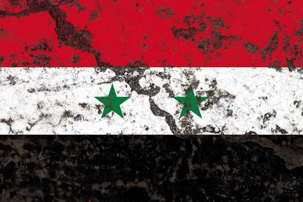 istock Syria flag on a cracked old concrete wall surface 1391532598