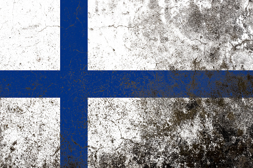 Finland flag on a grungy old concrete wall surface