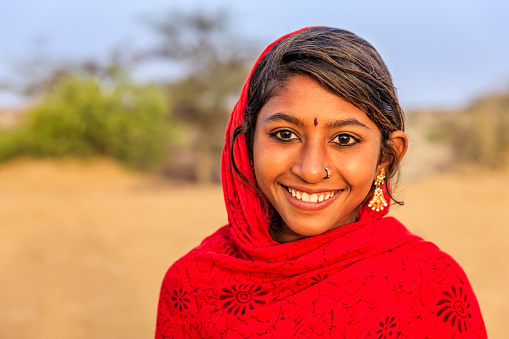 Happy Gypsy Indian girl from desert village, Thar Desert, Rajasthan, India.