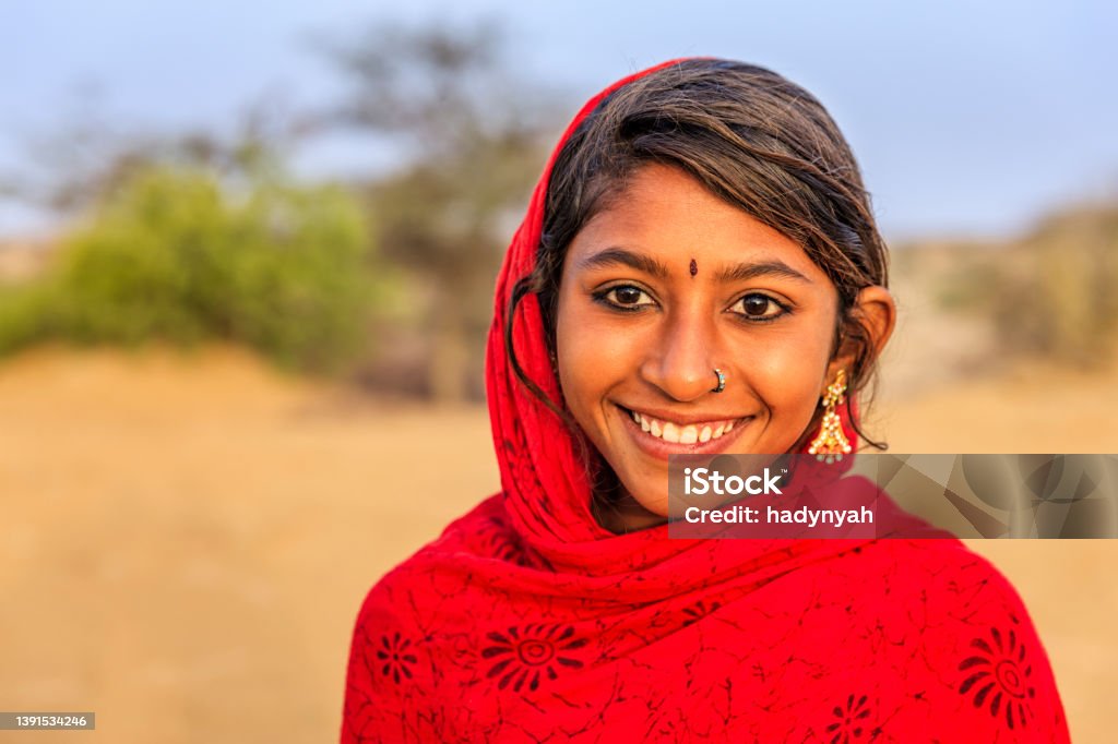 Portrait of happy Indian girl in desert village, India Happy Gypsy Indian girl from desert village, Thar Desert, Rajasthan, India. India Stock Photo