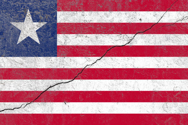 istock Liberia flag painted on a cracked old concrete wall 1391540042