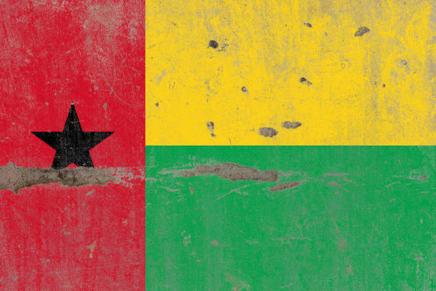 Grunge map of Guinea-Bissau with its flag printed within its border on an old paper.