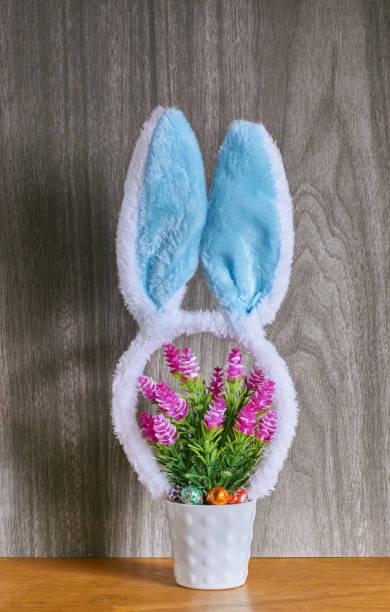 istock Rabbit ears headband on a decorative flower pot. Easter concept. 1391541836