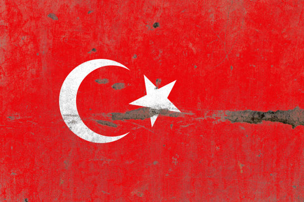 istock Turkey flag painted on a damaged old concrete wall surface 1391543890