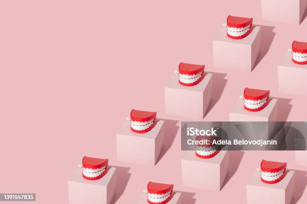 Creative Pattern With Teeth Toy On Pastel Pink Cube On Pastel Pink Background 80s Or 90s Retro Fashion Aesthetic Concept Minimal Romantic Smile Idea Stock Photo - Download Image Now