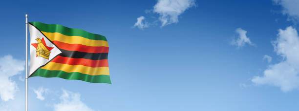 istock Zimbabwe flag isolated on a blue sky. Horizontal banner 1391548892