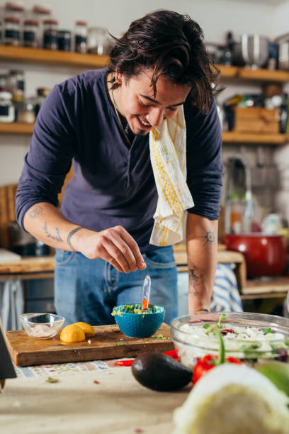 istock man preparing food at home 1391549045