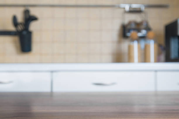 istock Kitchen table on the background of blurred kitchen. Selective focus.. 1391553008