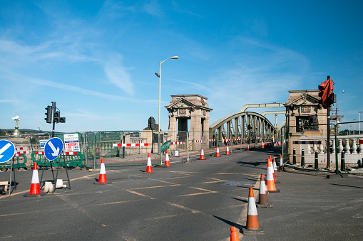 Rochester Bridge at Medway in Kent, England. Commercial signs and posters are visible.