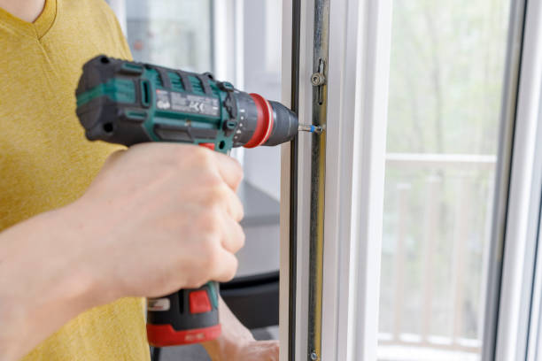 istock Handyman fixing a door 1391554274