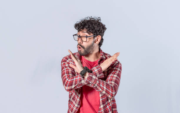 istock man without doing or stop sign isolated, a man crossing his arms with rejection expression, concept of man rejecting 1391556311