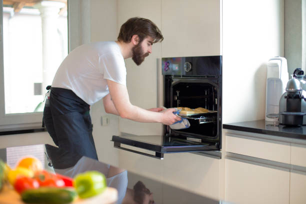 istock Young man baking pastries in the kitchen at home 1391557459