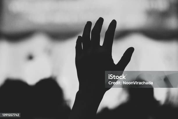 Hand Raising Concert Hand Raising For Religion Stock Photo - Download Image Now - Abstract, Adult, Arms Raised
