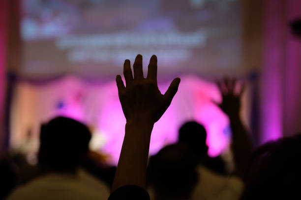 istock Hand raising concert, Hand raising for religion 1391557743