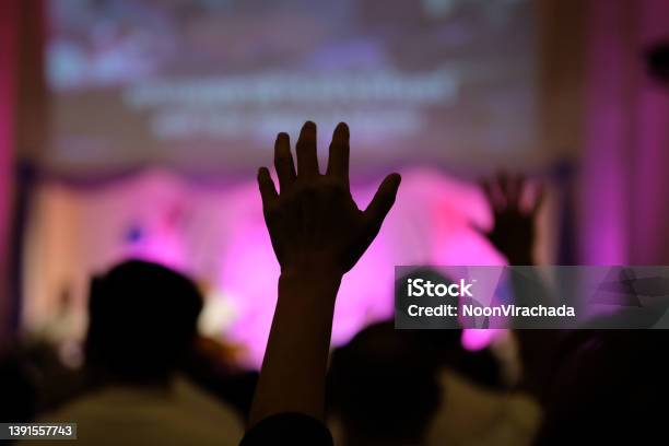 Hand Raising Concert Hand Raising For Religion Stock Photo - Download Image Now - Abstract, Clapping, Defocused