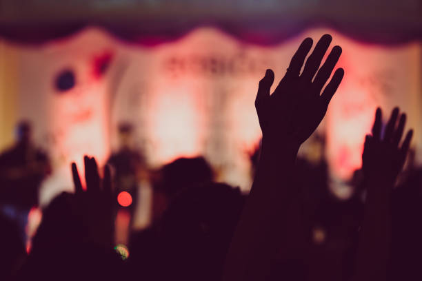 istock Hand raising concert, Hand raising for religion 1391557744