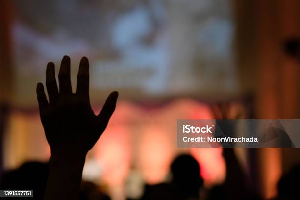 Hand Raising Concert Hand Raising For Religion Stock Photo - Download Image Now - Clapping, In Silhouette, Abstract