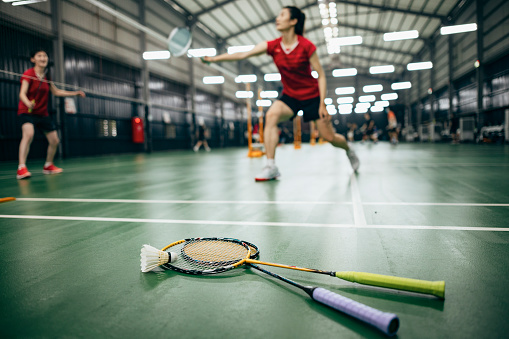 Indoor Badminton ball on green Badminton court