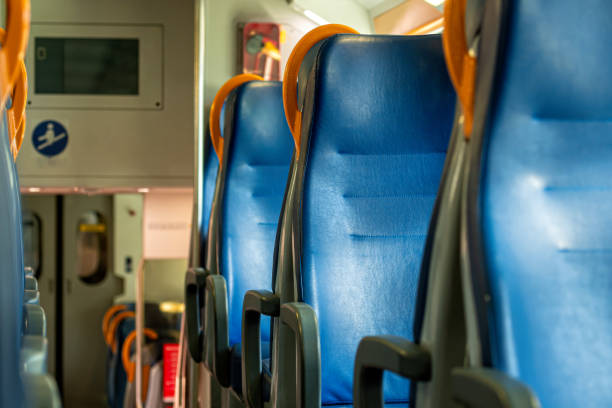 istock railroad train interior, seats in a train in a row, train carriage with blue seats 1391567135