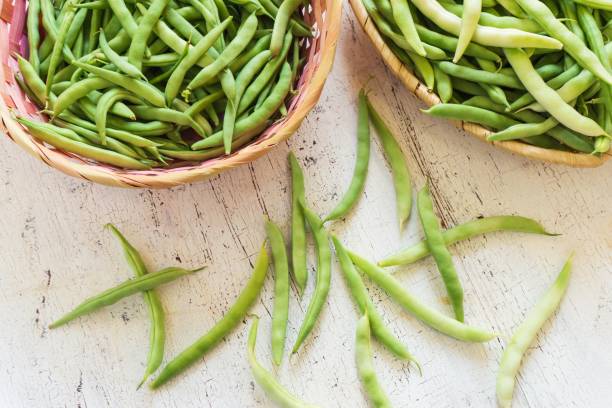 istock Bean pods in wicker baskets. Kitchen scene. 1391567188