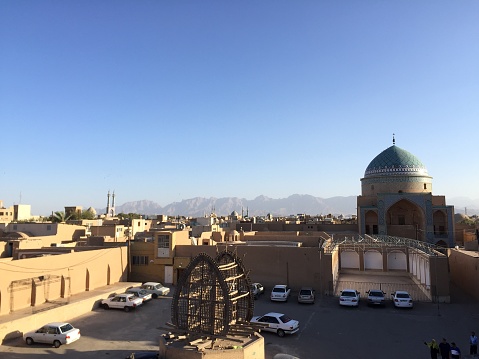 Yazd is an ancient city in central Iran known for its unique mud-brick architecture and Zoroastrian heritage. It's a UNESCO World Heritage site with historical mosques, underground water reservoirs, and traditional bazaars.