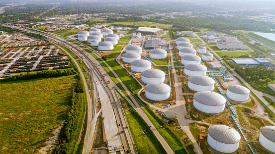 Aerial view of oil refinery nearby highway in Houston, Texas, USA.