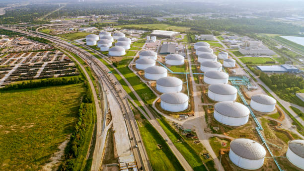 Oil refinery Aerial view of oil refinery nearby highway in Houston, Texas, USA. fuel storage tank photos stock pictures, royalty-free photos & images