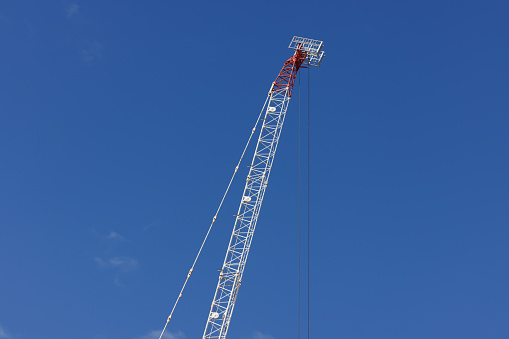 Large crane and blue sky.