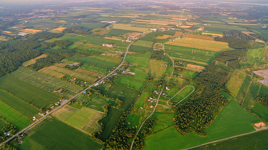 Aerial view of vast agricultural fields and farms in Montreal, Quebec, Canada.