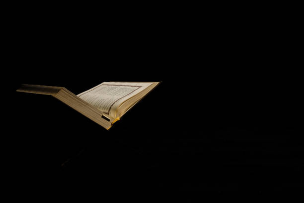 istock Quran with translation on dark background 1391580760