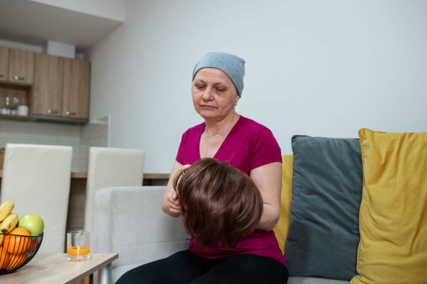 istock Chemotherapy patient preparing to put on a wig 1391581970