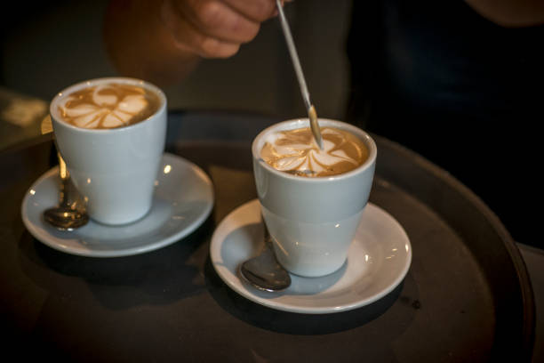 istock barista hand working on a coffee cup 1391581997