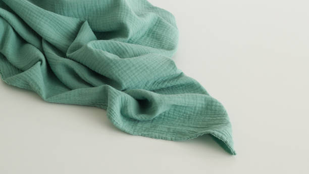istock Title: Fabric green cotton muslin. Green Textile Drapery 1391582229