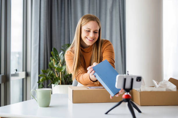 istock Woman vlogging from home about her online purchase 1391582950